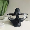 1pc Gothic Skull Glasses Holders, Skull Statues Eyewear Stand Crafts Tabletop Desktop Ornament, For Home Office Room Decor Birthday Halloween (4.8*5.6*5.6in), Day Of The Dead Decor