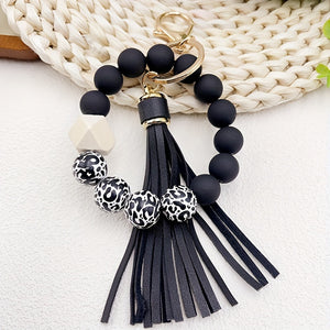 1pc Stylish Leopard Pattern Silicone Wooden Beaded Wristlet Keychain - Fashionable PU Leather Tassel Bag Charm, Phone Lanyard, Bangle Keychain for Women's Daily Use - Perfect Gift for Friends and Family